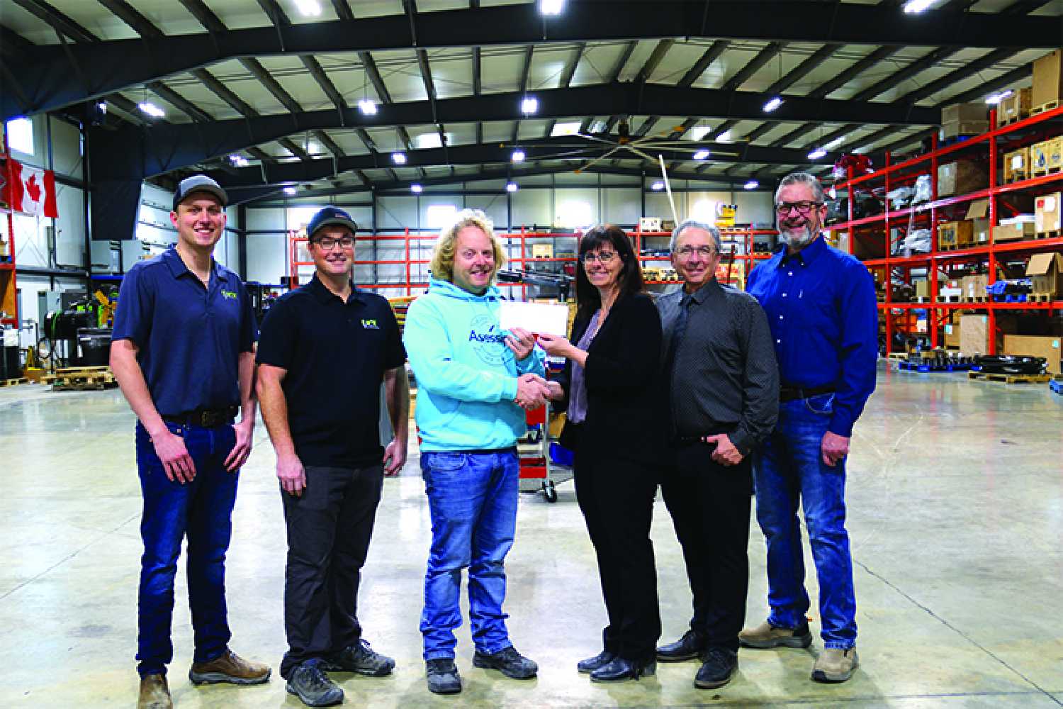 IJACK presented a cheque for $500,000 recently for the Moosomin Airport Expansion project. From left are Graham Mannle, Richie Barry, and Dan McCarthy of IJACK, and Kendra Lawrence, Jeff St. Onge and Dr. Van of the Airport Committee.